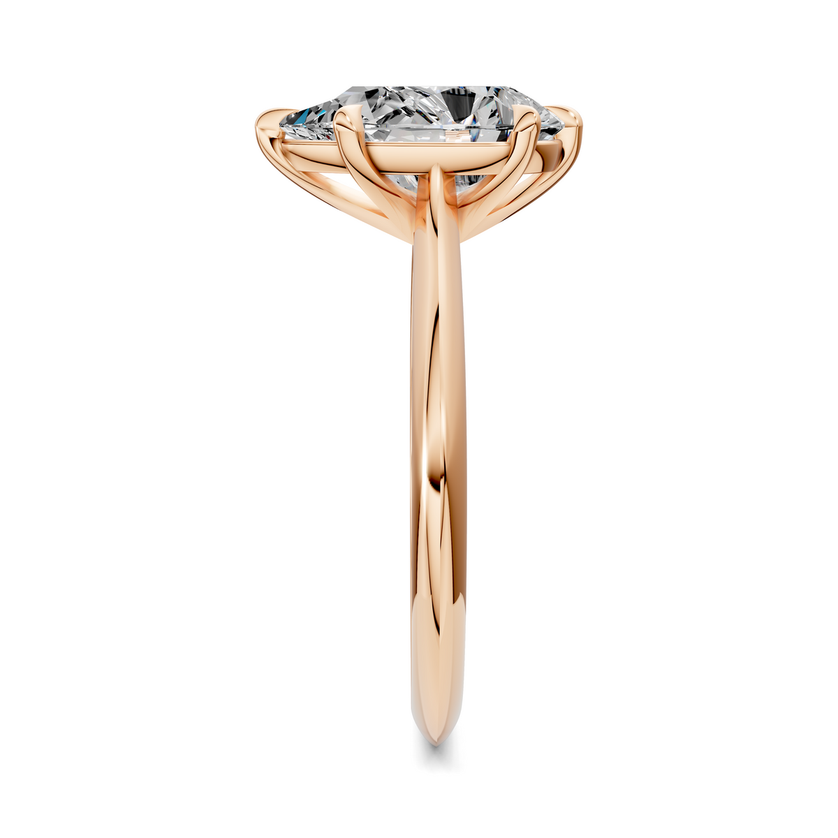 Rose gold solitaire engagement ring with tall setting and four-prong center stone