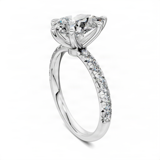 Pear-cut pavé engagement ring with scalloped band in white metal