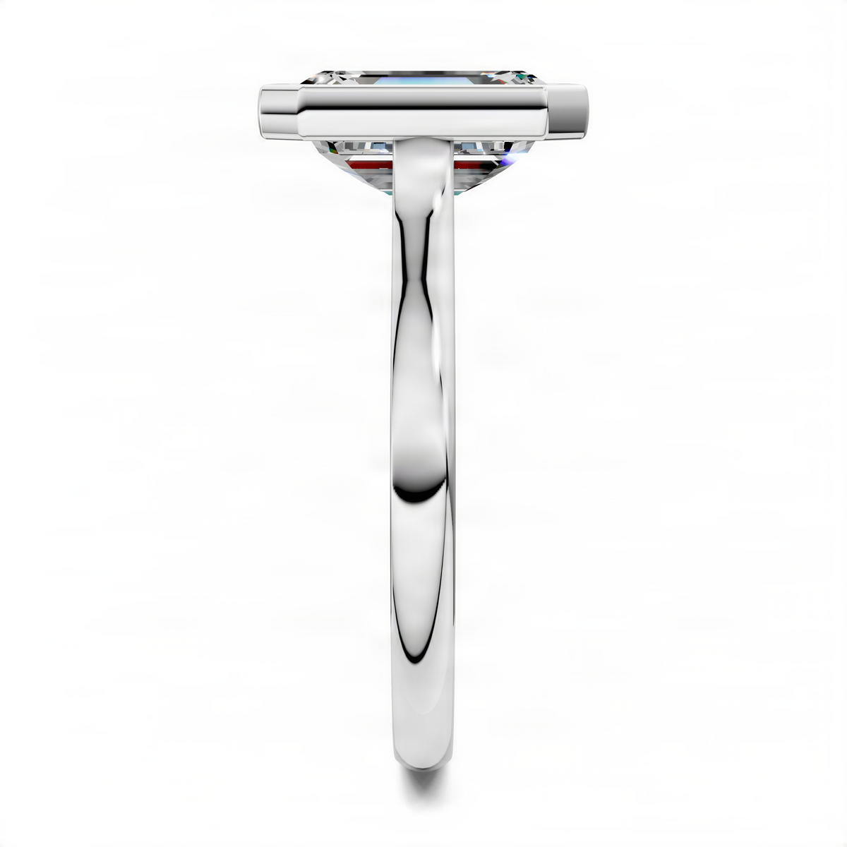 White gold emerald-cut solitaire ring with bezel and cathedral setting