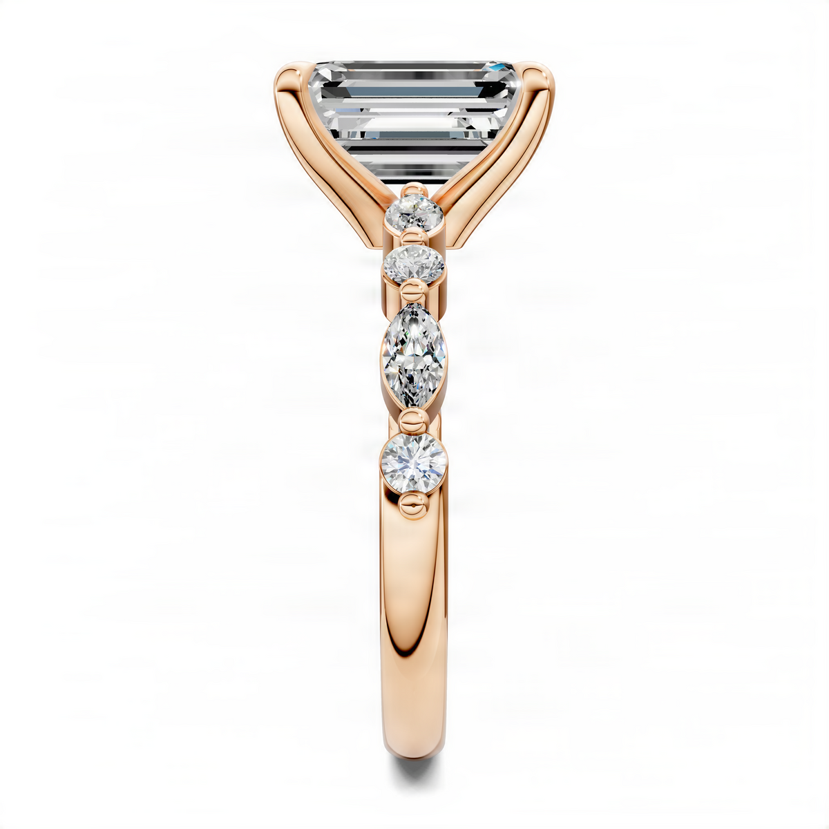 Rose gold accent ring with rectangular center stone and three round drop stones