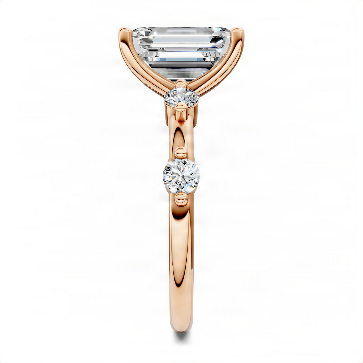 Rose gold ring with emerald-cut top and round diamond accents