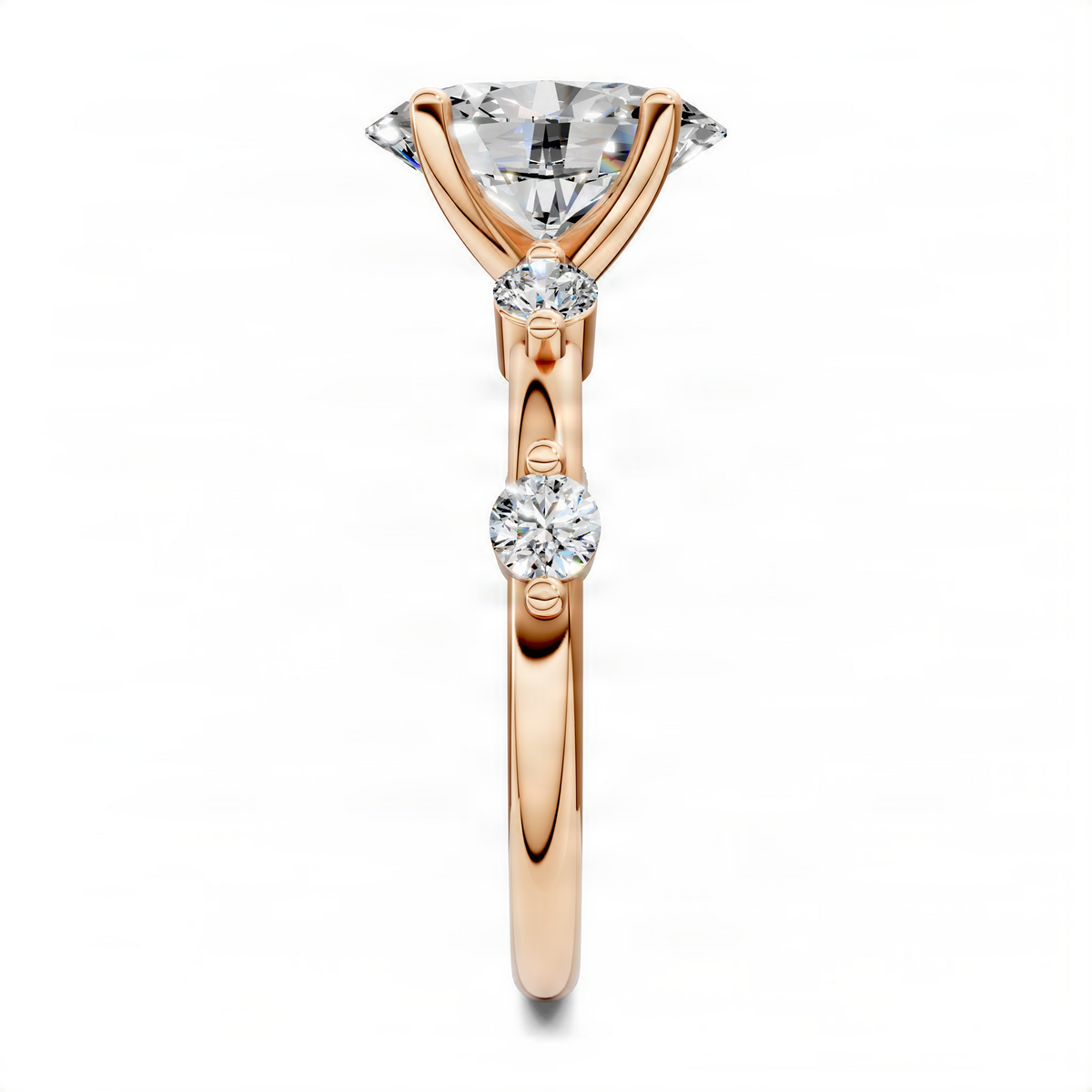 Rose gold oval engagement ring with two round accent stones and prong-set center