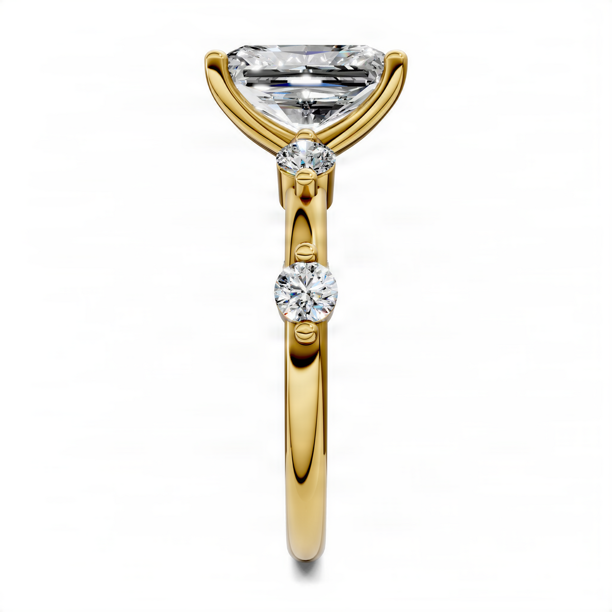 Yellow gold round accent ring with square-cut top stone and two small round stones
