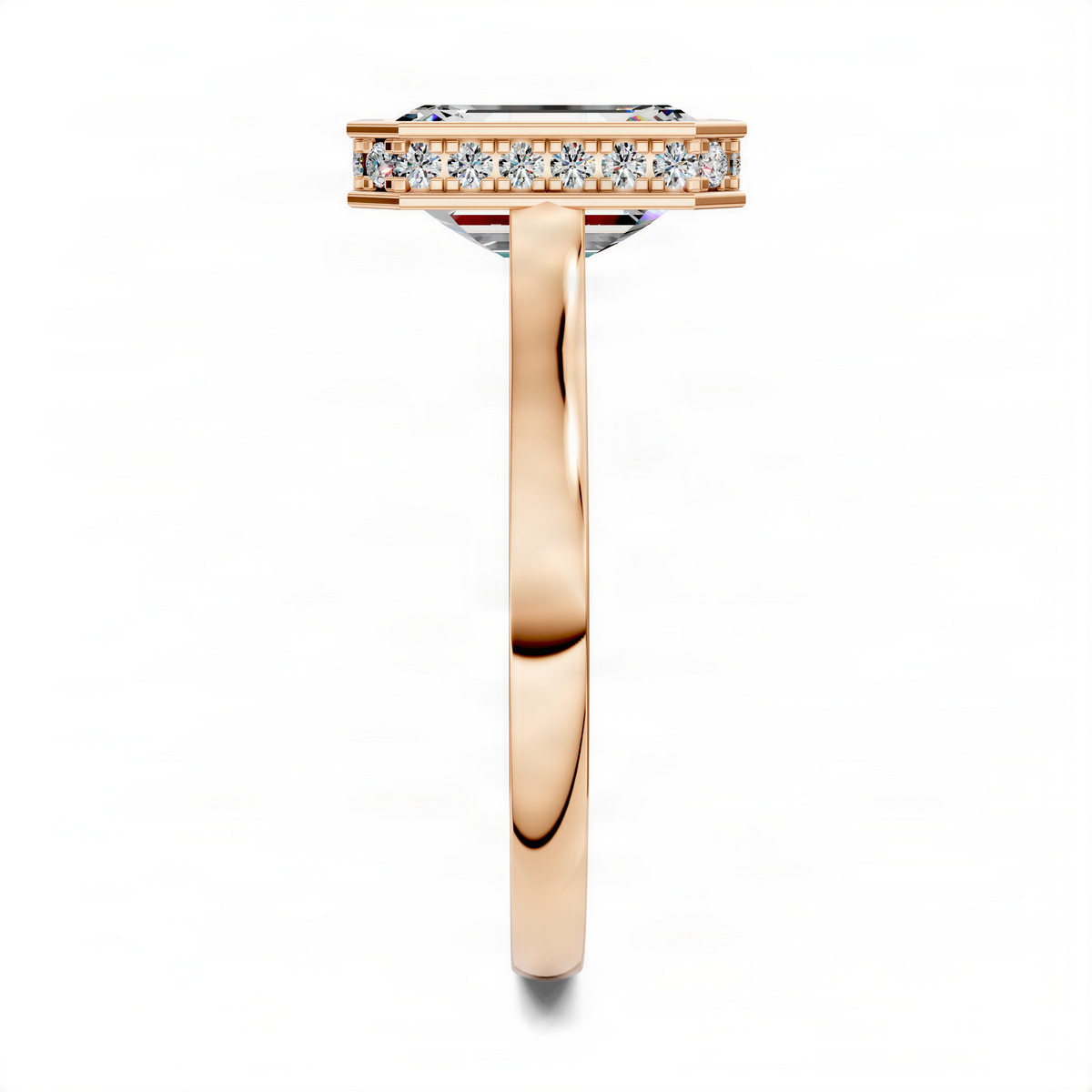 Emerald bezel halo ring in yellow gold, side view with pavé stones