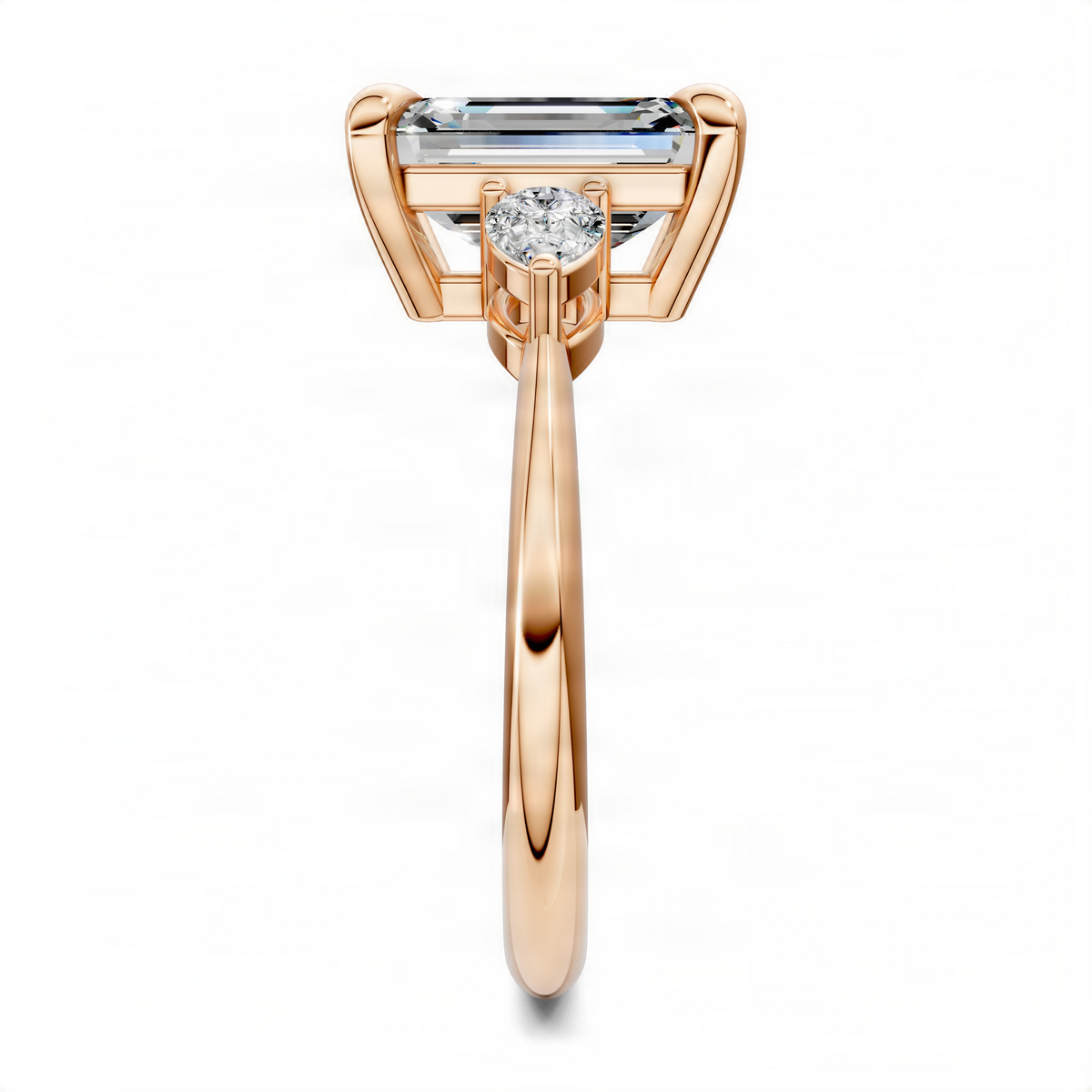 Rose gold three-stone ring angled view with emerald-cut center stone and prong-set stones
