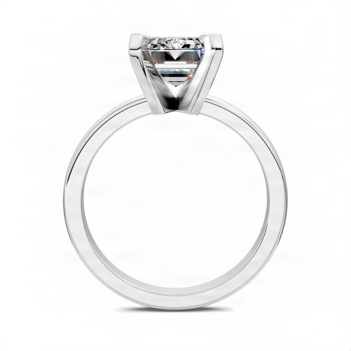 Solitaire ring with emerald-cut clear center stone in a white metal band