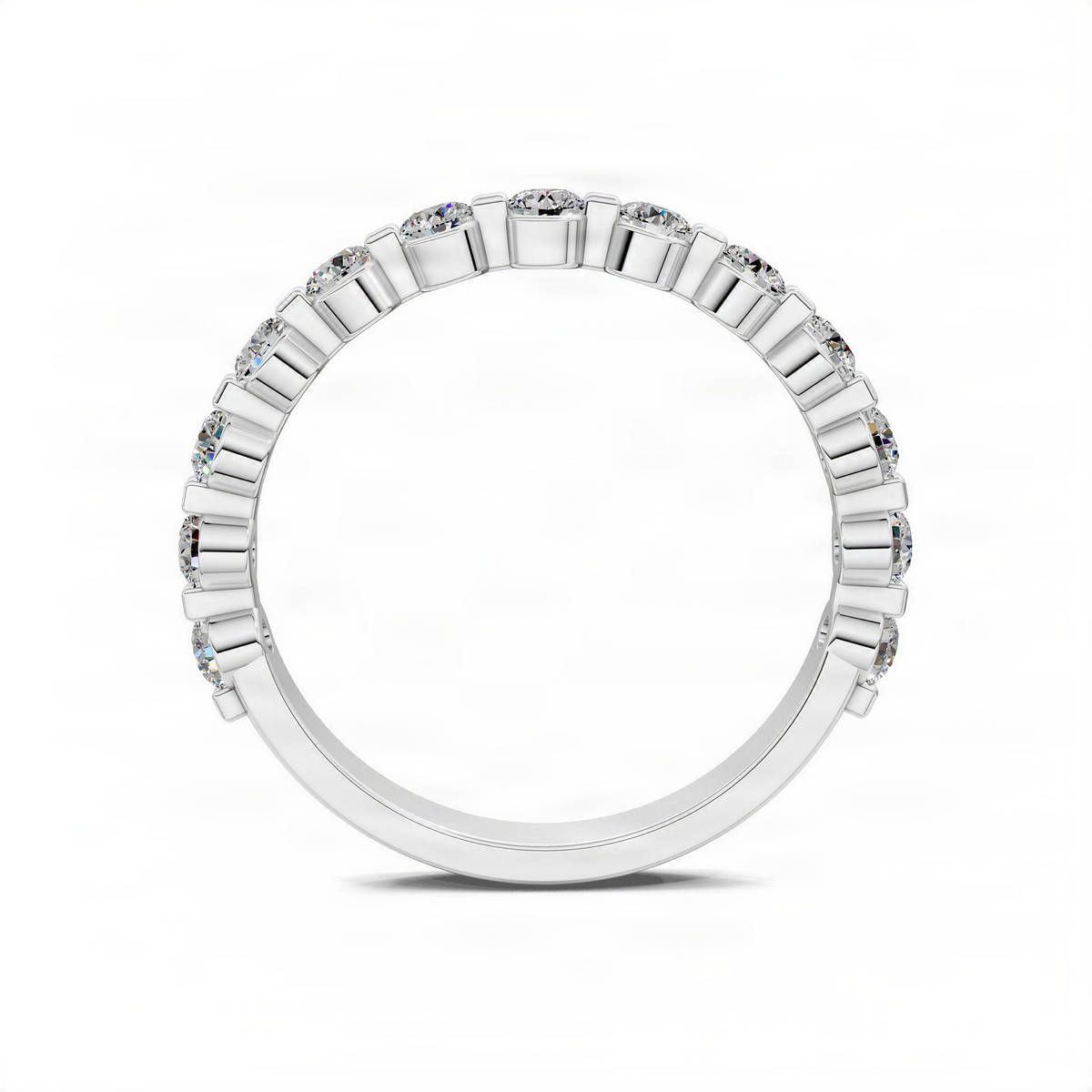 White gold wedding band with a row of diamond accents and polished settings