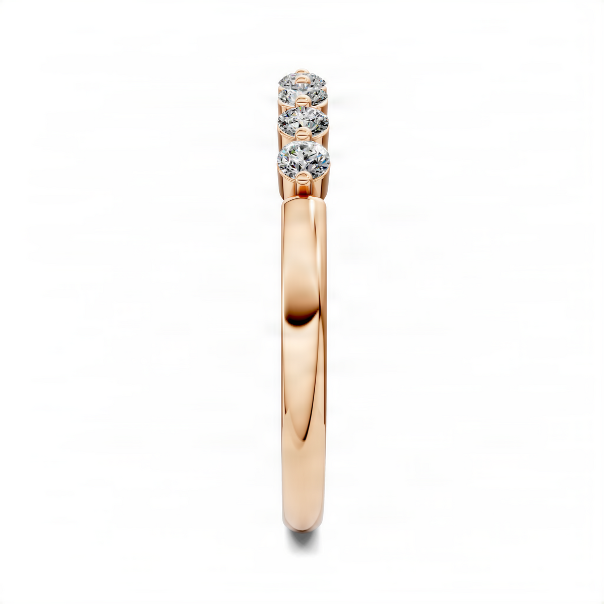Rose gold quarter eternity band with three visible round diamonds, side view