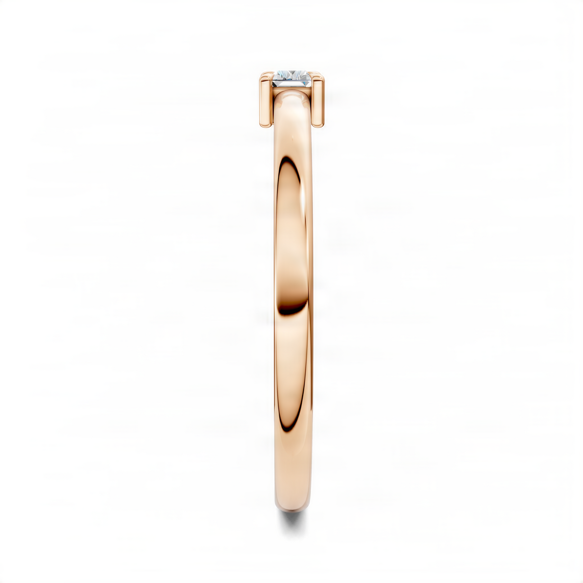 Rose gold baguette stacker ring side view featuring rectangular clear gemstone