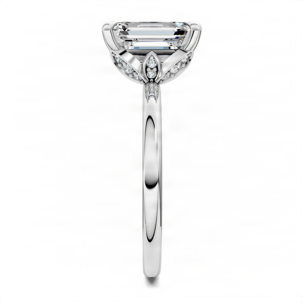 White gold engagement ring with emerald-cut center stone and leaf-like side details