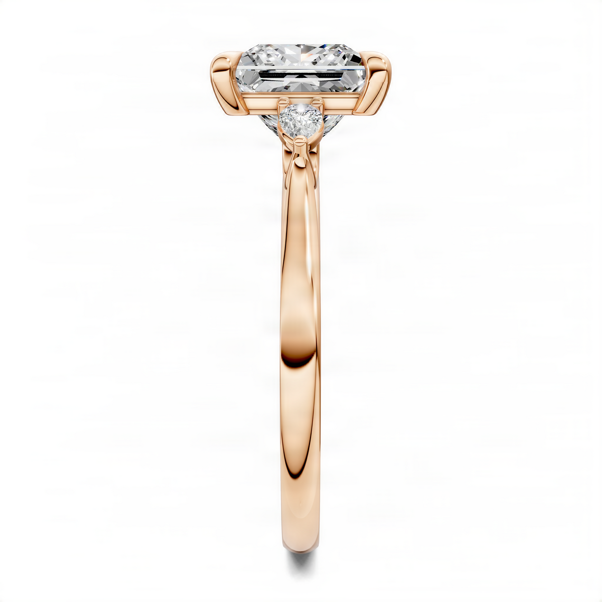 Three-stone ring in rose gold with rectangular center stone and round side diamonds