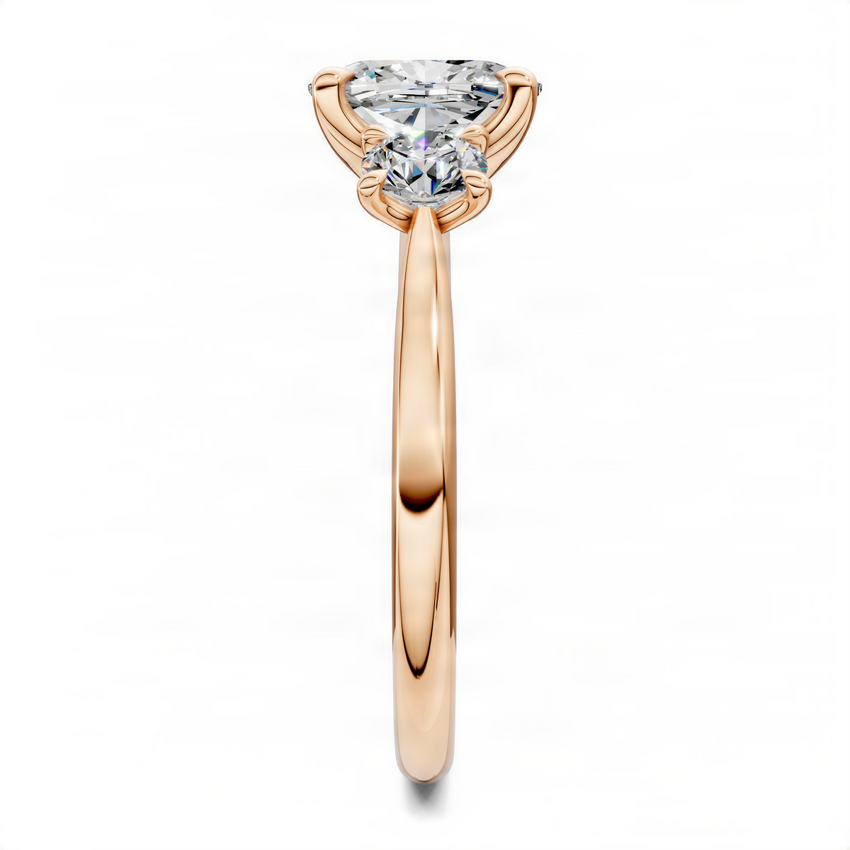 Three-stone cushion diamond ring in rose gold, side profile