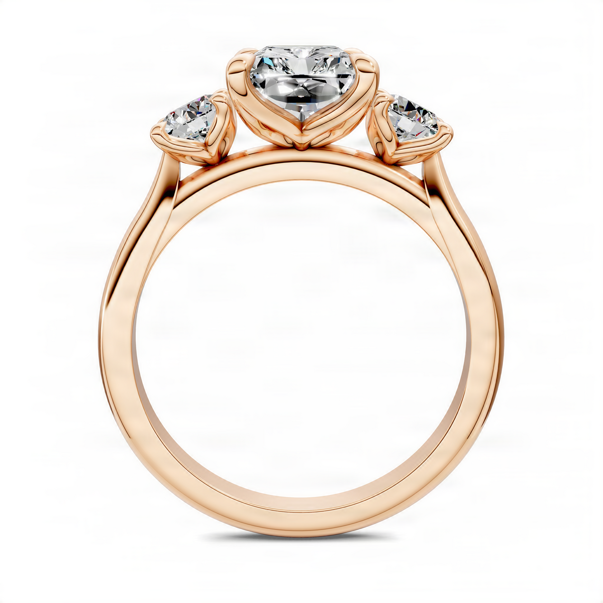 Rose gold three-stone ring top view with square center diamond and two side stones