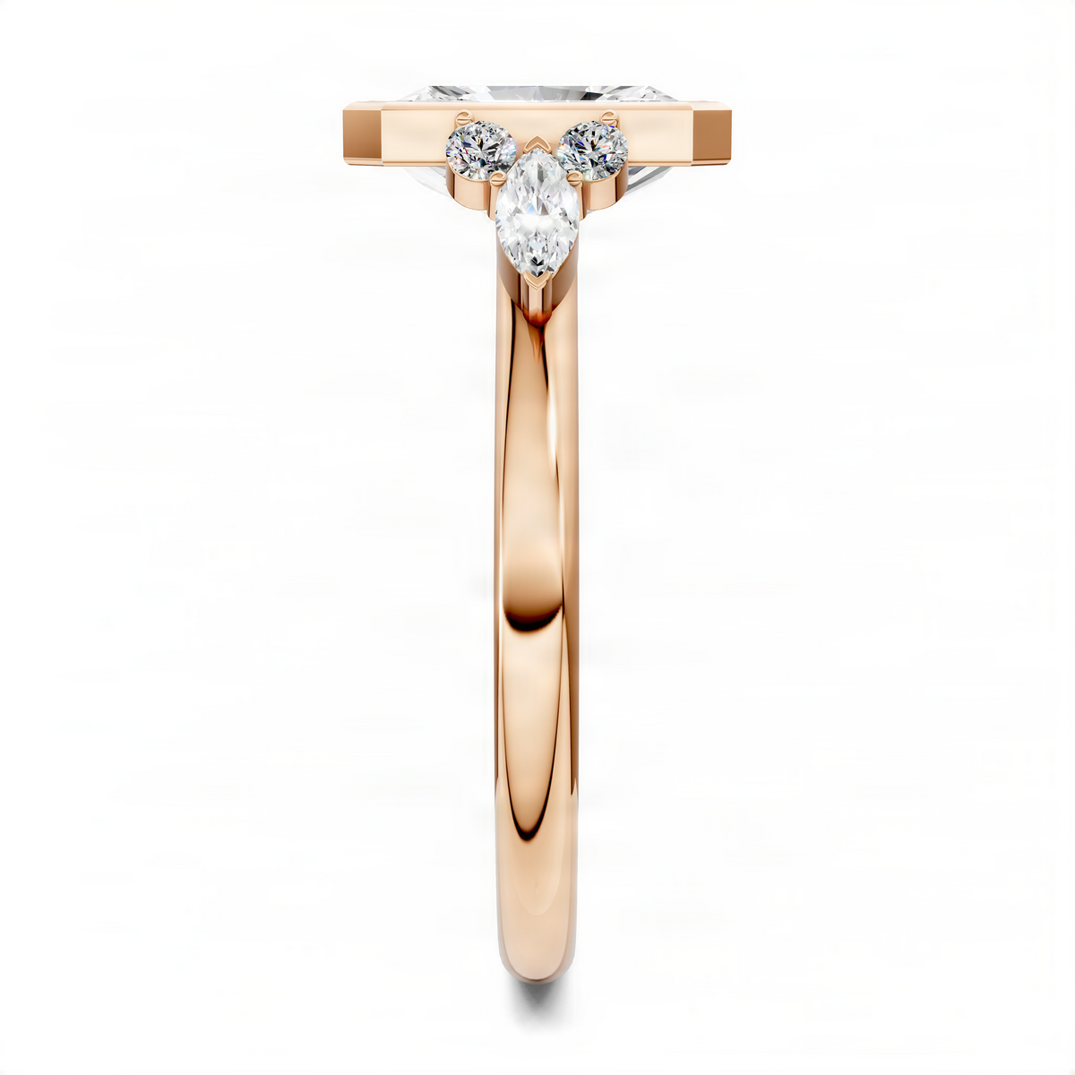 Rose gold radiant bezel ring with rectangular center stone and three side stones.