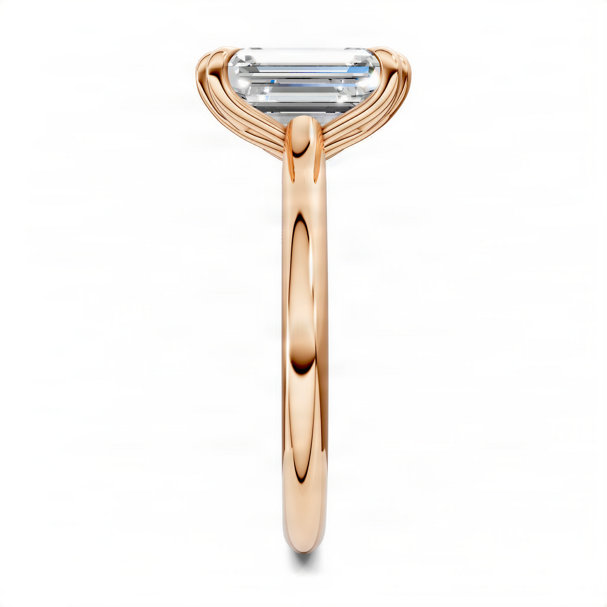 Emerald-cut gemstone ring with petal prong setting, rose gold band in profile view