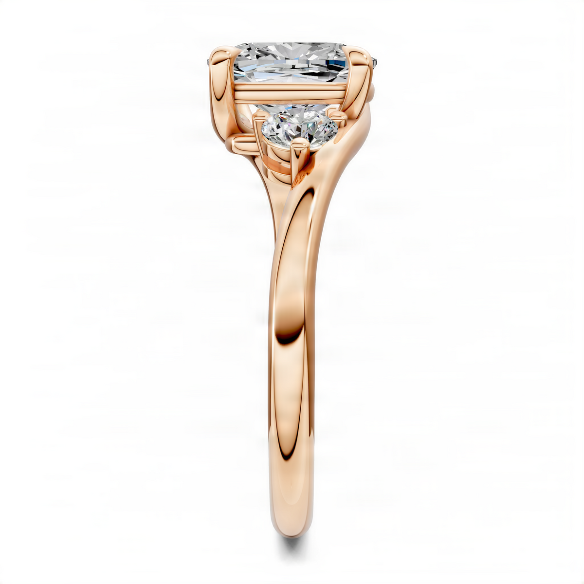 Rose gold cushion bypass three-stone ring with cushion center and two side stones