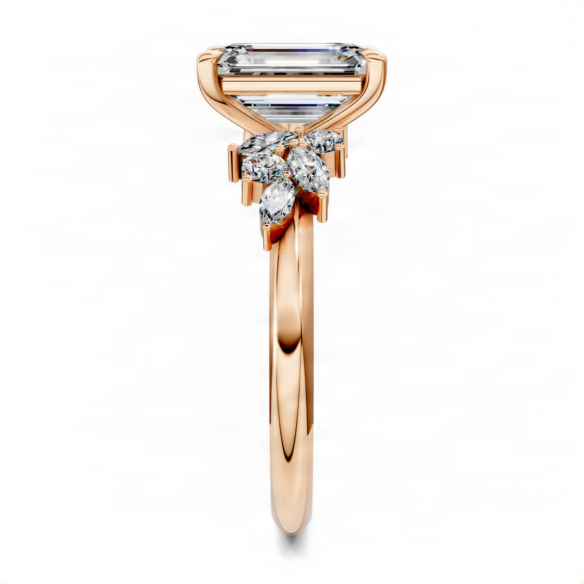 Rose gold emerald-cut diamond cluster ring with high prong center and marquise accents