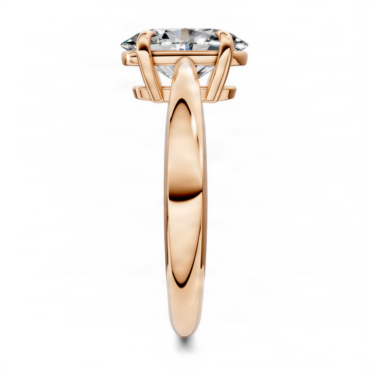 Gold oval solitaire engagement ring with elongated tapered band and prong-set stone