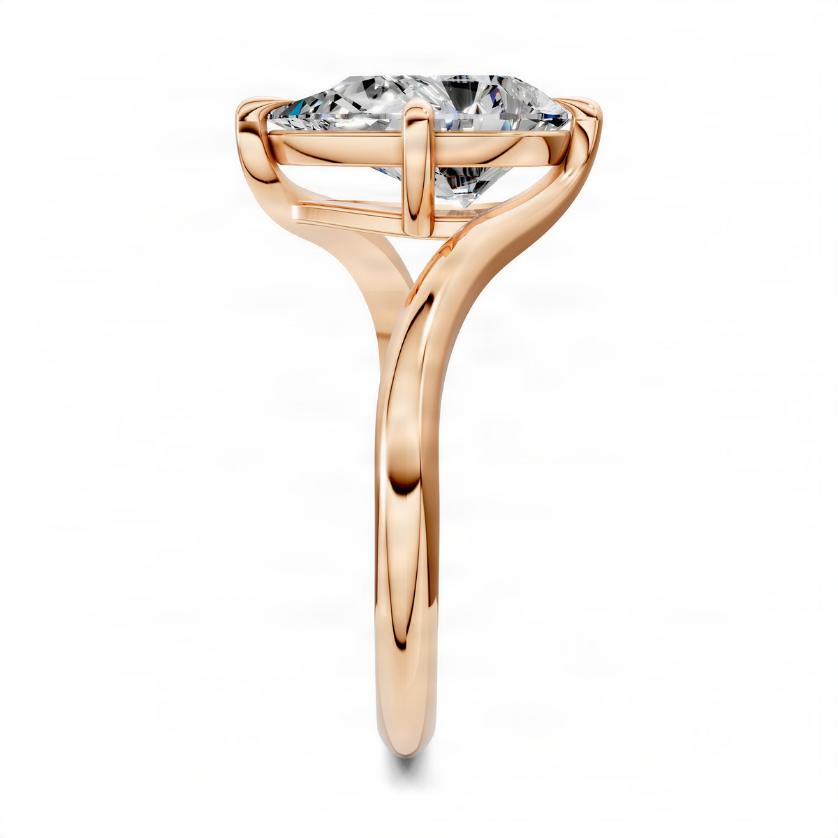 Rose gold bypass solitaire ring with pear-cut center stone in a sculpted setting