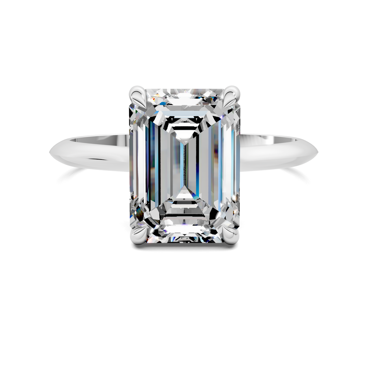 White gold solitaire ring with emerald-cut center stone, four corner prongs