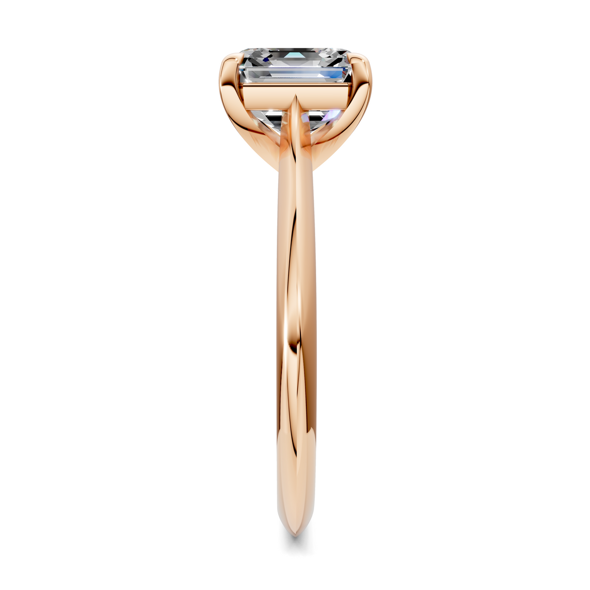 Rose gold solitaire ring side view slim band with rectangular emerald-cut gemstone