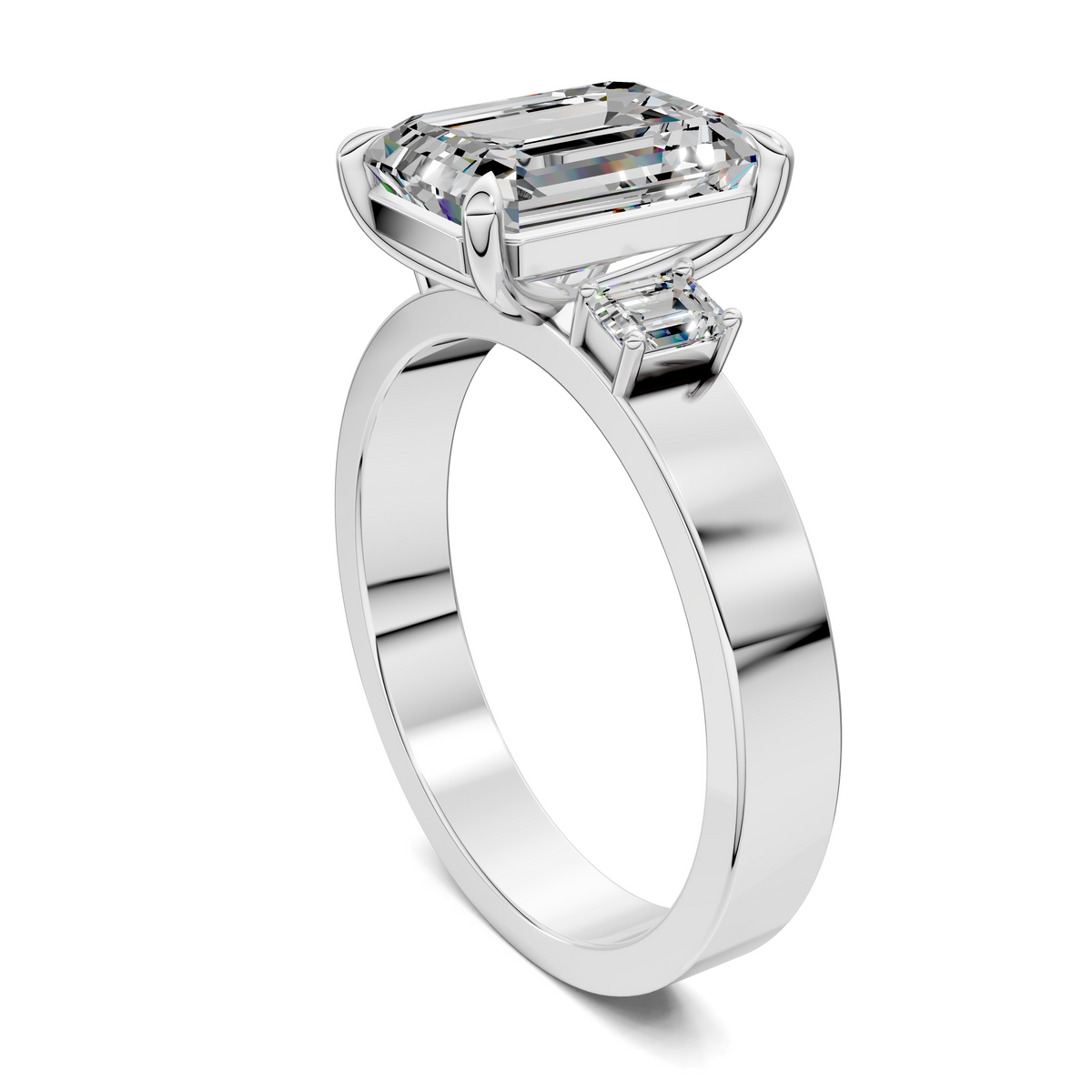 14K white gold three-stone ring angled view, emerald-cut center stone and side stones