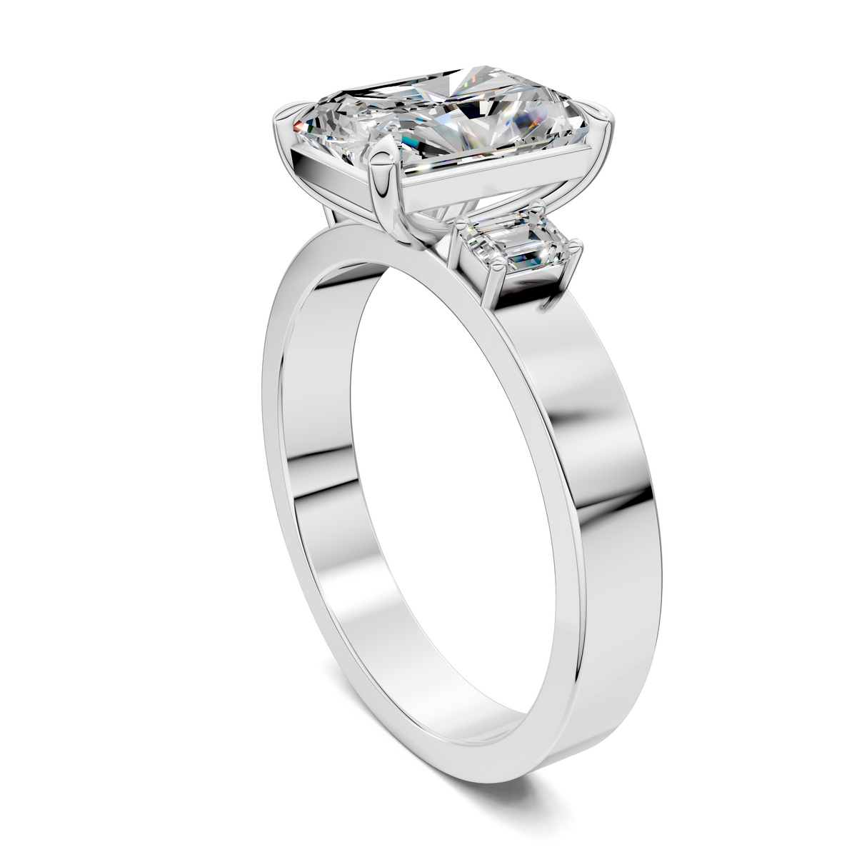 Three-stone engagement ring, angled view of cushion-cut center stone and side stones