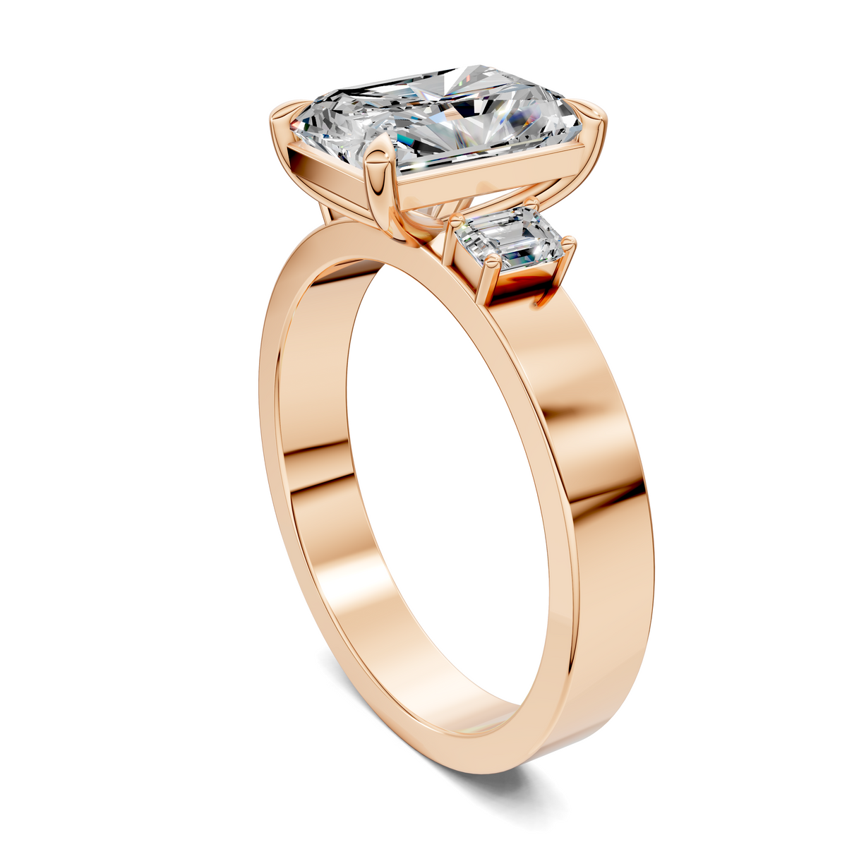 Three-stone ring in rose gold, angled view of cushion-cut center stone with side stones
