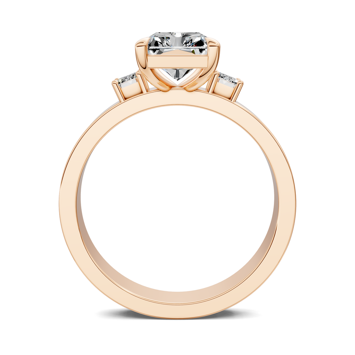 Rose gold three-stone ring with one large center and two baguette stones