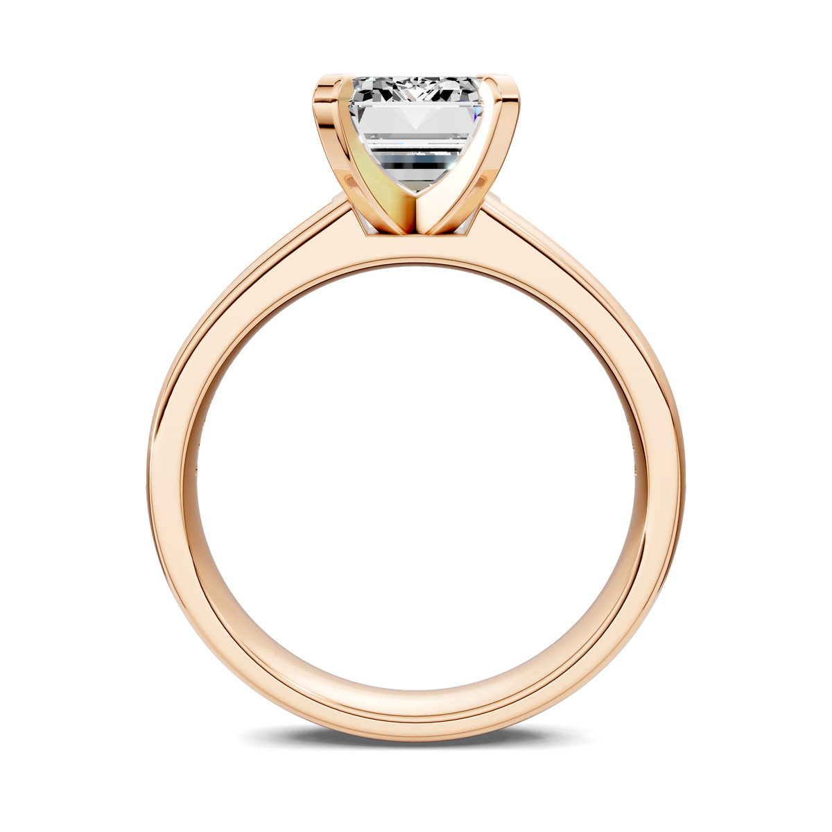 Rose gold channel ring with baguette-cut center stone in a raised setting