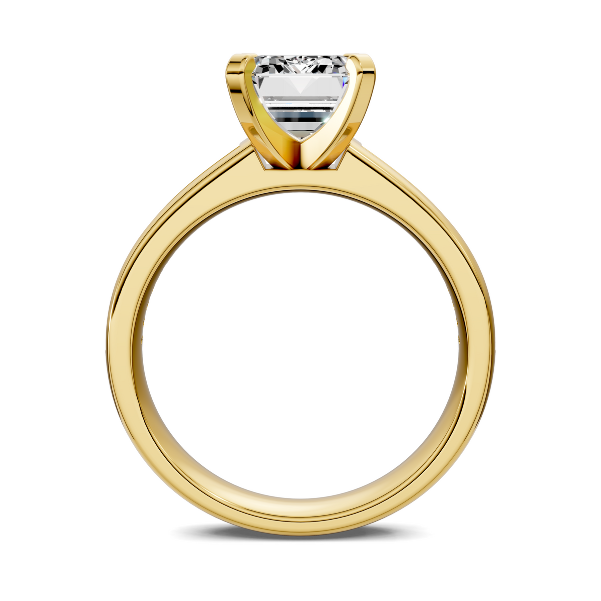 Yellow gold ring with emerald-cut center setting and prongs, smooth band visible.