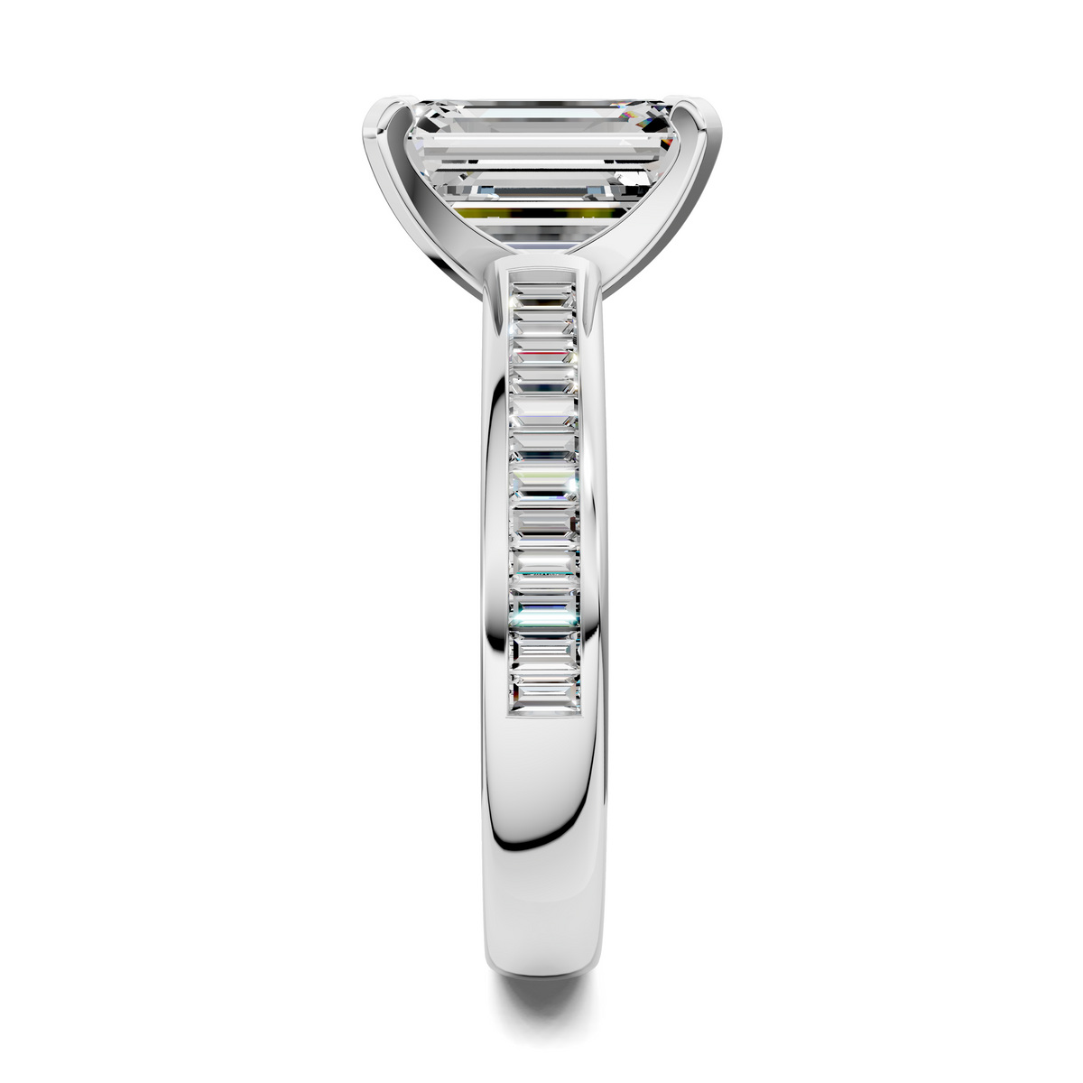 White metal ring with baguette channel band and emerald-cut center stone in prongs.