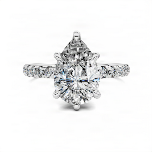 Pear-cut diamond pavé ring with scalloped band in white metal