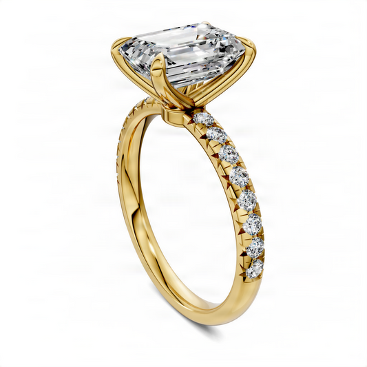Emerald-cut pavé ring with scalloped yellow gold band and clear center stone