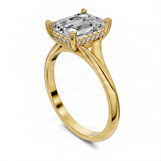 Yellow gold split-shank ring featuring emerald-cut center stone and hidden halo