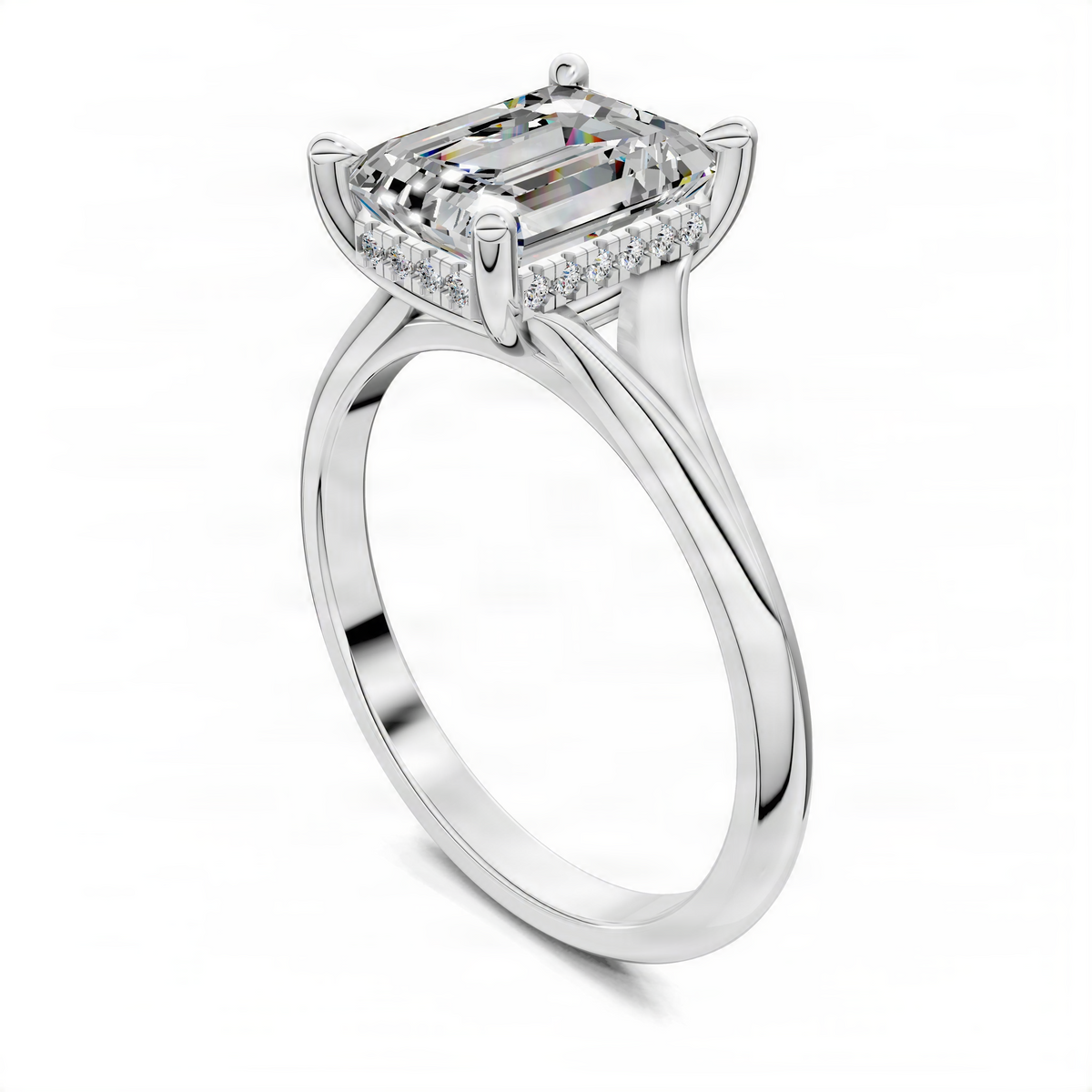 White gold split-shank engagement ring with emerald-cut center stone and hidden halo