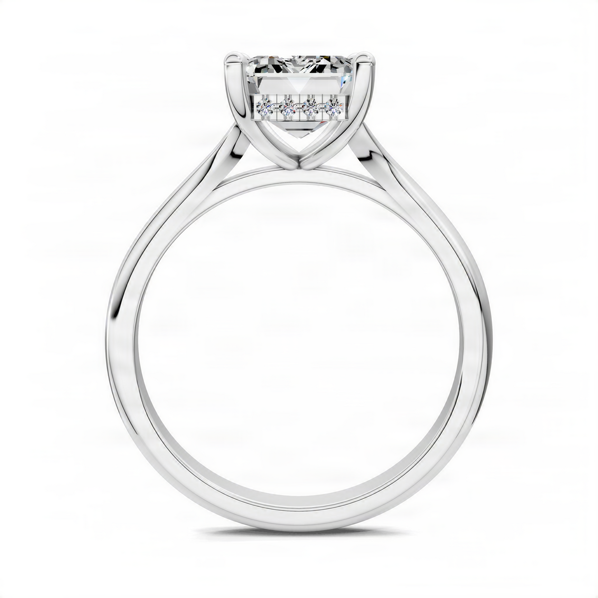 White gold engagement ring with emerald-cut center stone and hidden halo