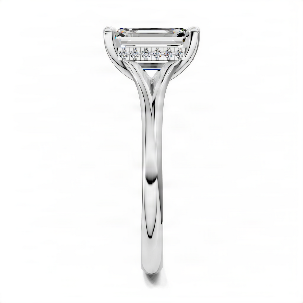 White gold emerald-cut engagement ring with split shank and prong-set center stone