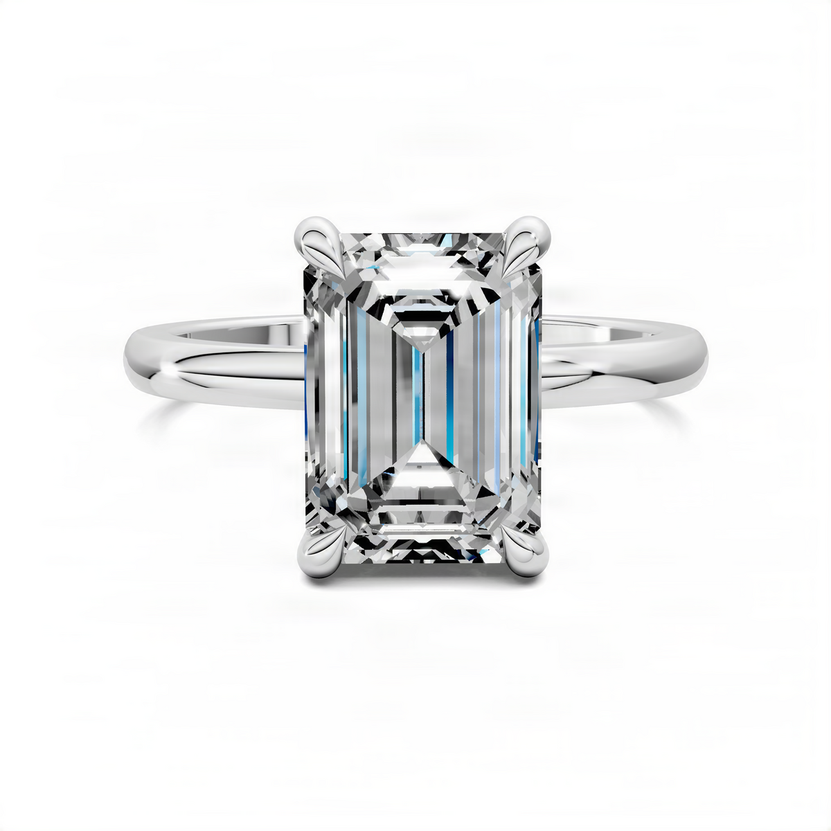 Emerald-cut crystal engagement ring with white metal band and four-prong setting