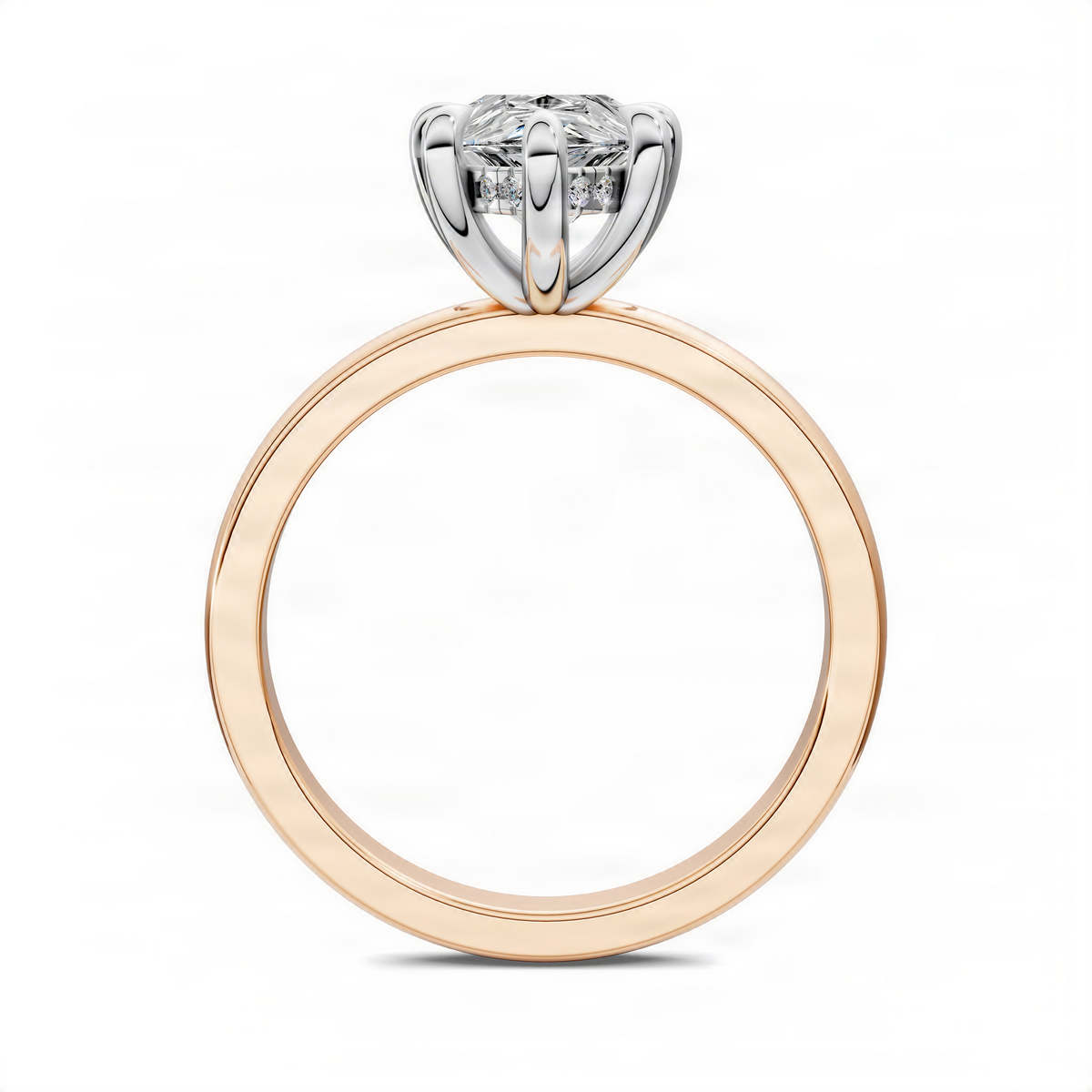 Two-tone ring with rose gold band and white metal prongs, pear-shaped center stone