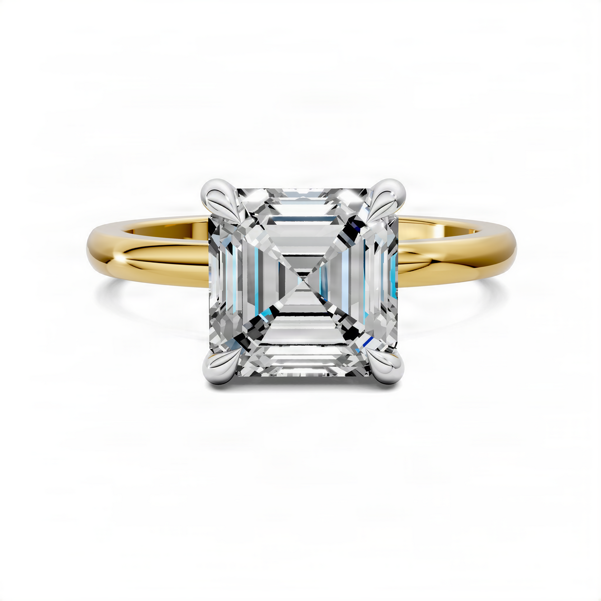 Mixed metal ring: emerald-cut center with four-prong setting; yellow gold band