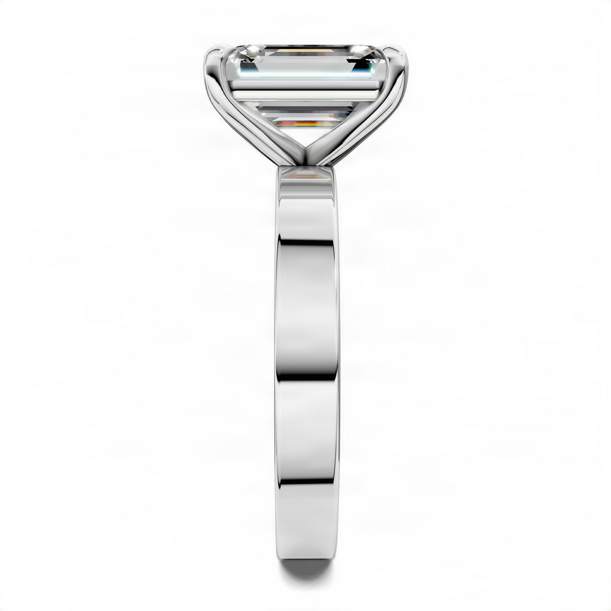 Silver solitaire ring with rectangular stone, close-up of prongs and slim band