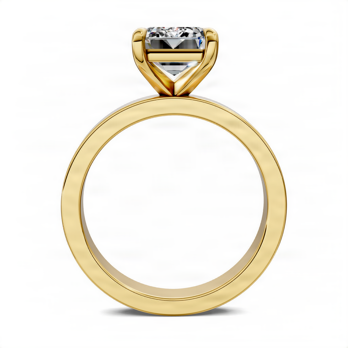 Yellow gold solitaire ring with rectangular clear gemstone in raised bezel setting