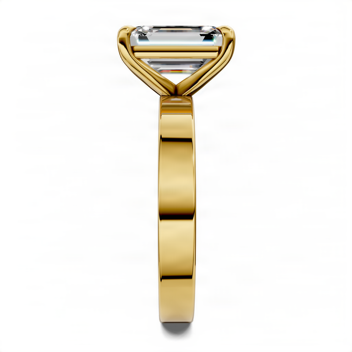Yellow gold solitaire ring, side view, rectangular clear gemstone in bezel setting