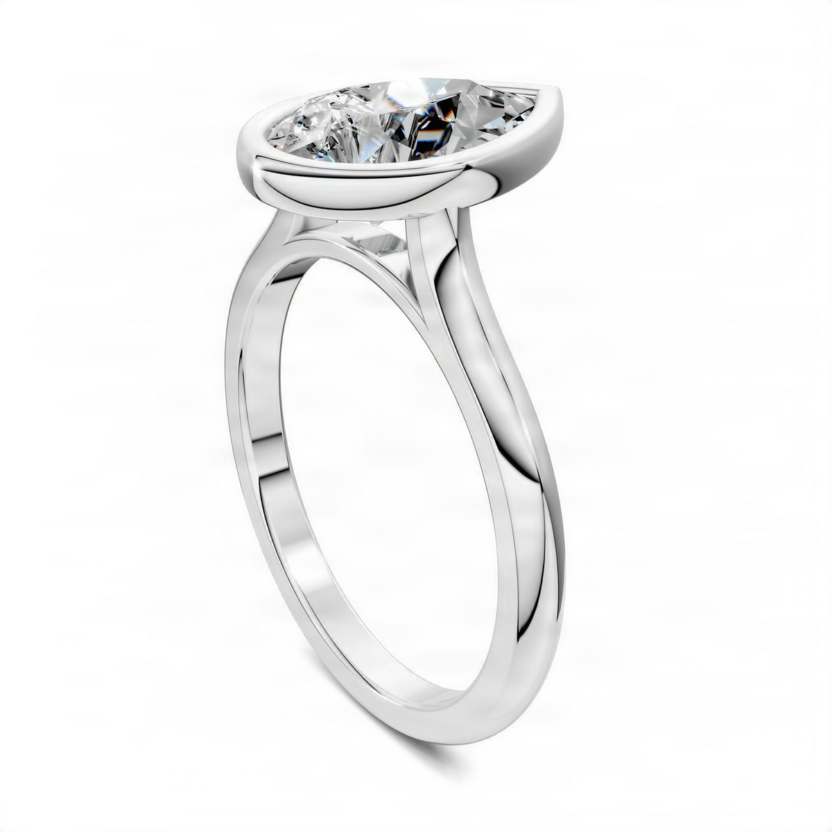 White gold pear bezel solitaire ring showing angled band and bezel-set pear diamond