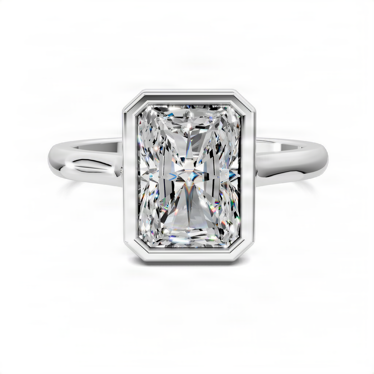 White gold solitaire ring with radiant-cut bezel-set center stone and smooth band