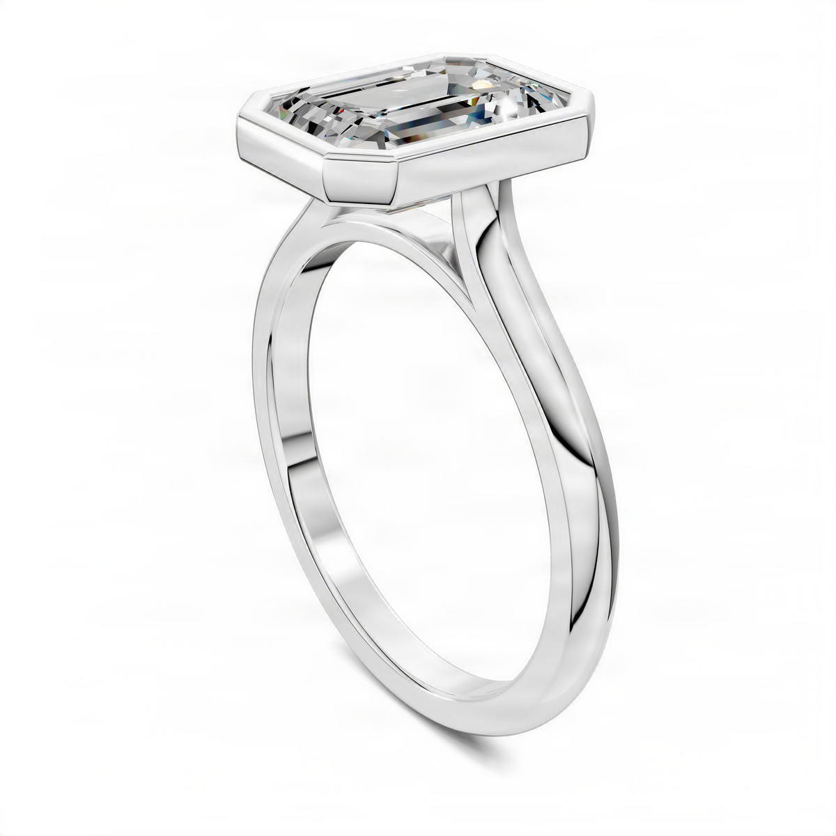 Emerald-cut solitaire ring with cathedral-set bezel on white metal band