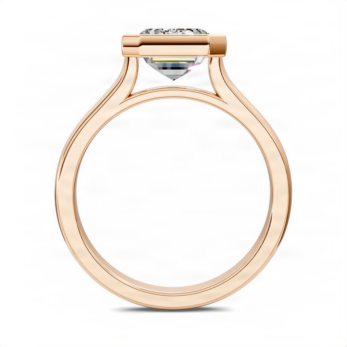 Rose gold emerald-cut solitaire ring with bezel top and cathedral setting