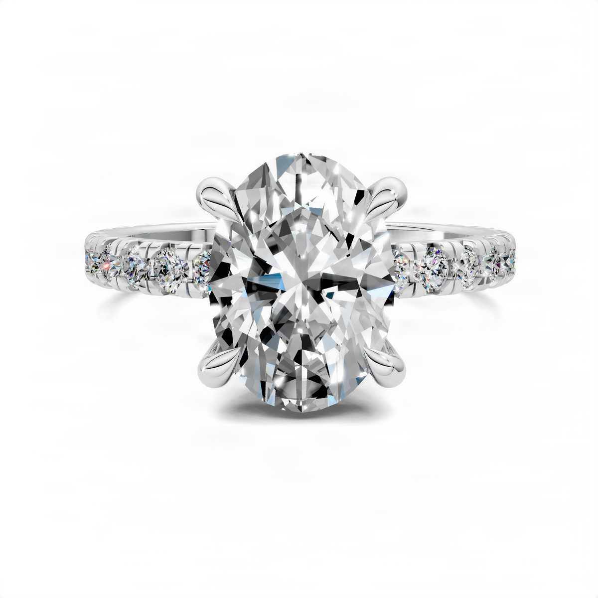 Oval diamond engagement ring with pavé band and prong setting