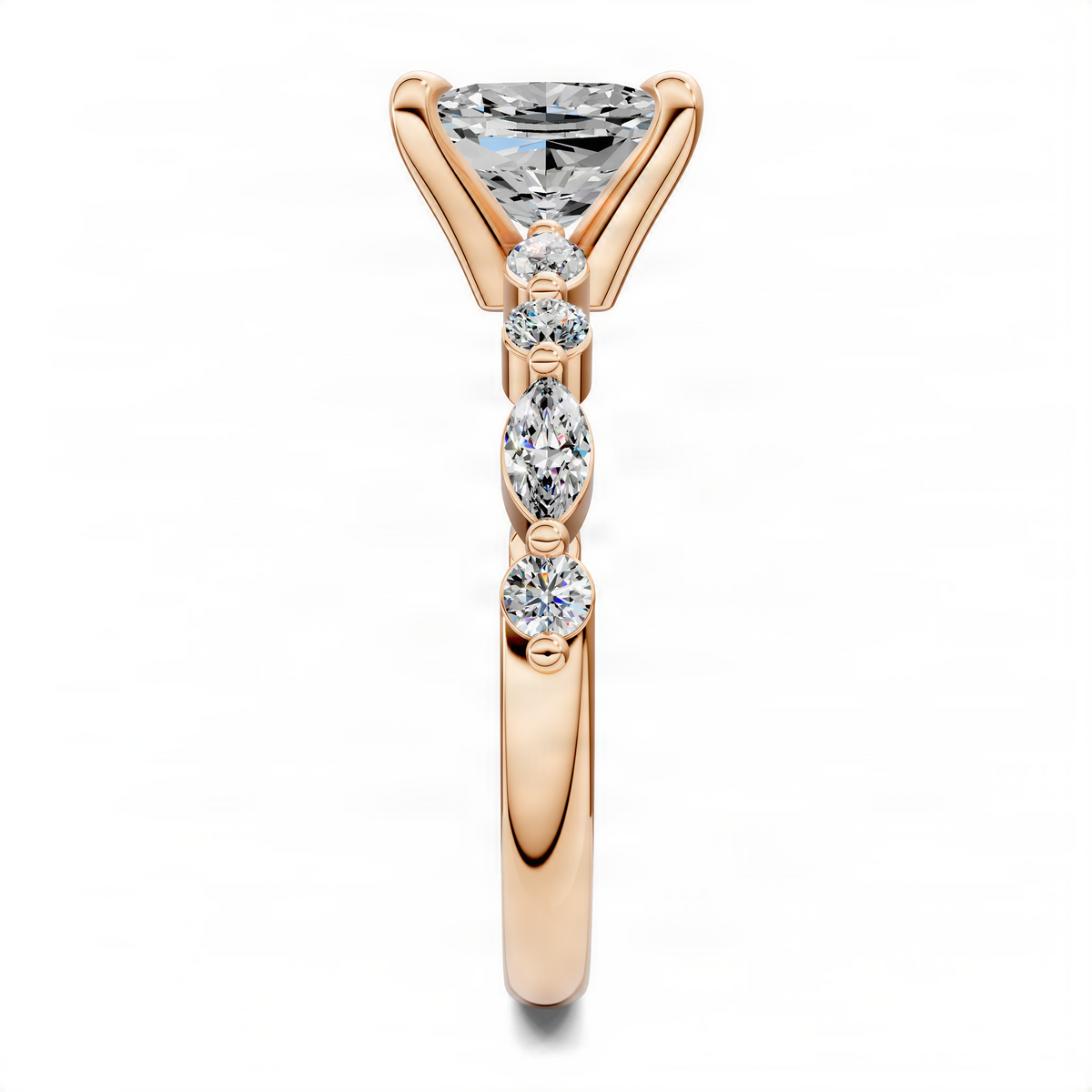 Rose gold cushion-cut diamond ring with pear-shaped stones and three-stone lower detail